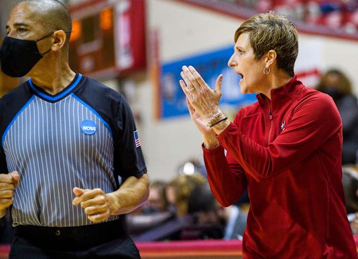 Teri Moren claps on the sideline.
